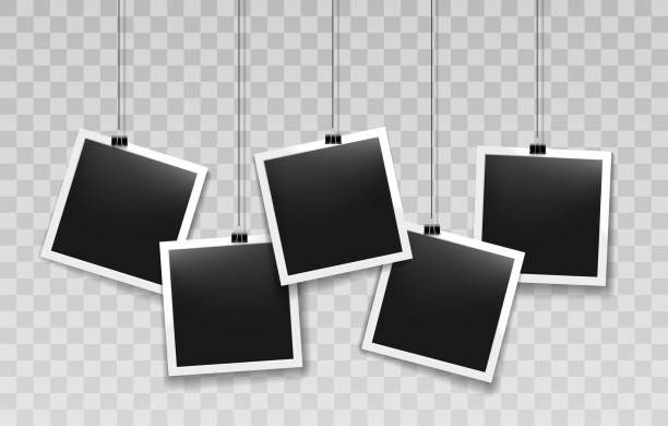 Hanging instant photo frames Hanging instant photo frames. Paper vintage photos on thin cord clips, string hang retro black photography pictures, vector illustration rope photos stock illustrations