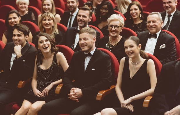 istock Happy audience sitting in opera house 1214328662