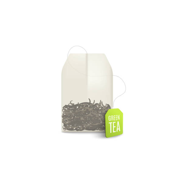 Realistic green tea bag with dried leaves and green label tag Realistic green tea bag with dried leaves and green label tag isolated on white background - single teabag mockup for healthy hot beverage. Vector illustration teabag stock illustrations