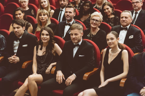 istock Happy audience sitting in opera house 1214328944