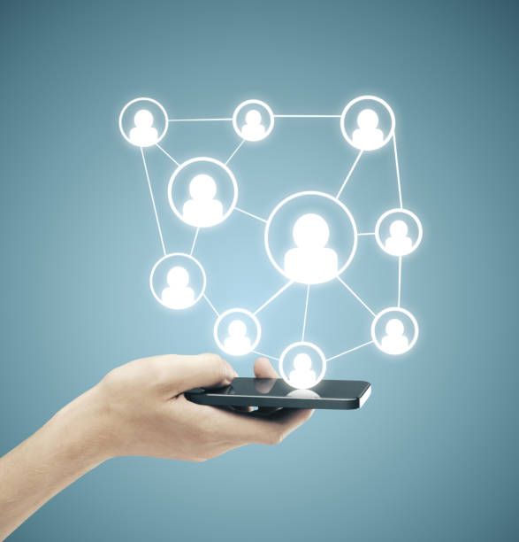 istock Hand hodling phone with social media plan. 1214328975