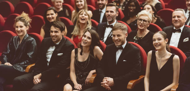 istock Happy audience sitting in opera house 1214329142