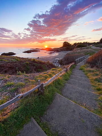 Family on beach at sunset in northern California at The Sea Ranch