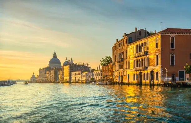 Photo of Venice grand canal, Santa Maria della Salute church landmark at sunrise. Italy