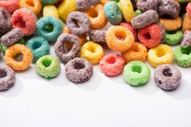 istock close up view of bright multicolored breakfast cereal on white background 1214331770