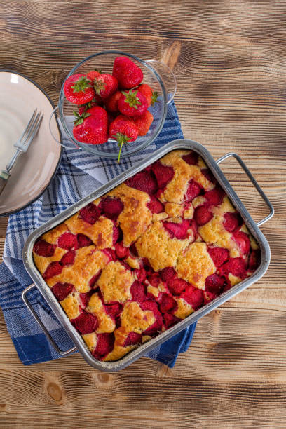 istock Yeast cake with strawberry in a mold. 1214333364