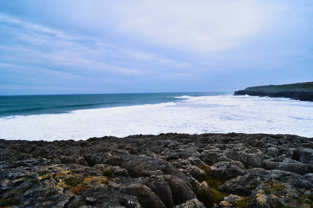 istock sea view with rocks and clouds 1214333971