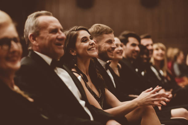 Smiling audience sitting in the theater