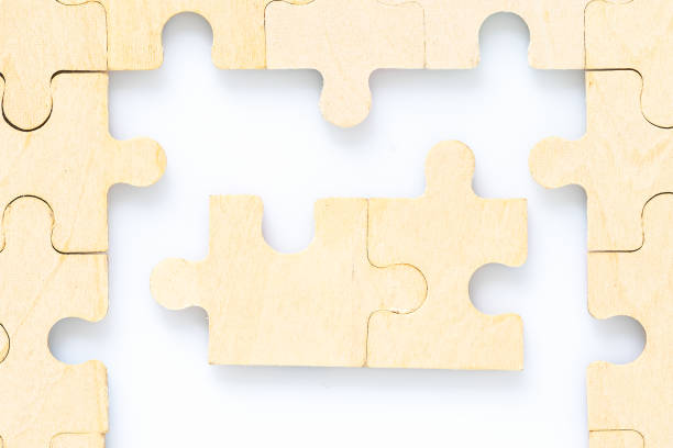 istock wooden jigsaw puzzle pieces on white background 1214335370
