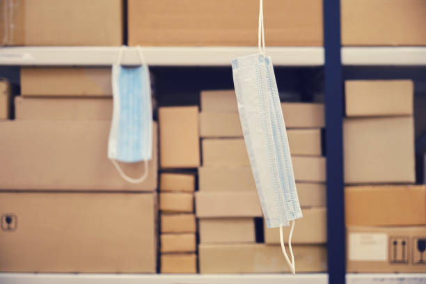 istock Quarantine in a warehouse with boxes due to a virus 1214337034