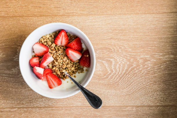 istock Yogurt bowl with granola and strawberries 1214338164