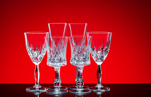 Glass glasses shot in the studio on a red background