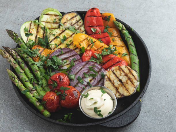 istock grilled vegetables white sauce asparagus, zucchini, pepper, onion, tomatoes 1214340387