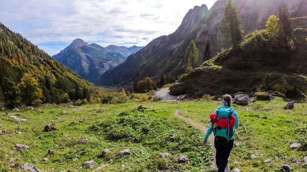 istock High Wait - A girl wandering through Alpine valley 1214340843