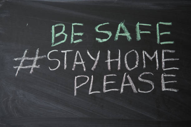 istock Hashtag stay at home. Outbreak Warning. written white chalk on blackboard in connection with epidemic of coronavirus worldwide. 1214341046