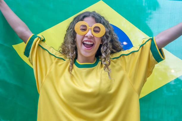 istock Young woman cheering for Brazil 1214341077