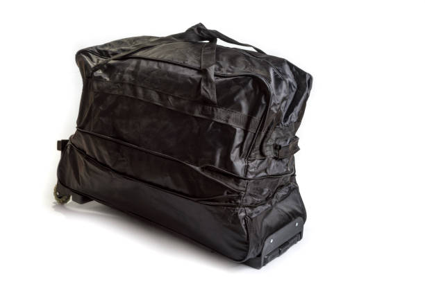 istock Black travel bag on a white background 1214341909