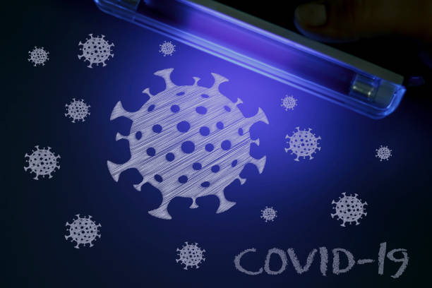 moléculas de covid-19 bajo luz uv - luz ultra violeta fotografías e imágenes de stock