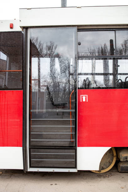 istock Closed red tram doors in a parking lot 1214346134