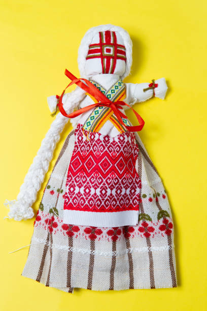 istock Handmade fabric toy on a yellow background 1214346479