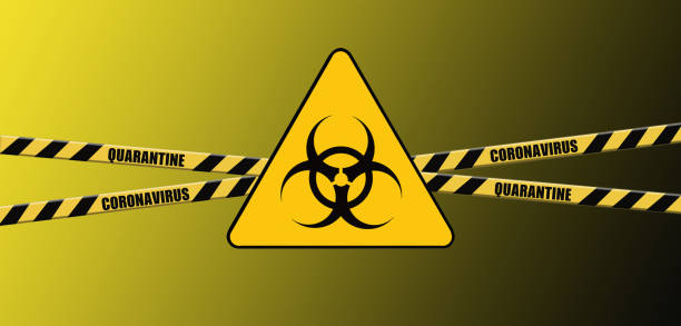 istock Warning coronavirus quarantine yellow and black biohazard sign on yellow background, hazard quarantine, , covid-19, coronavirus quarantine sign, coronavirus caution and warning tape 1214346702
