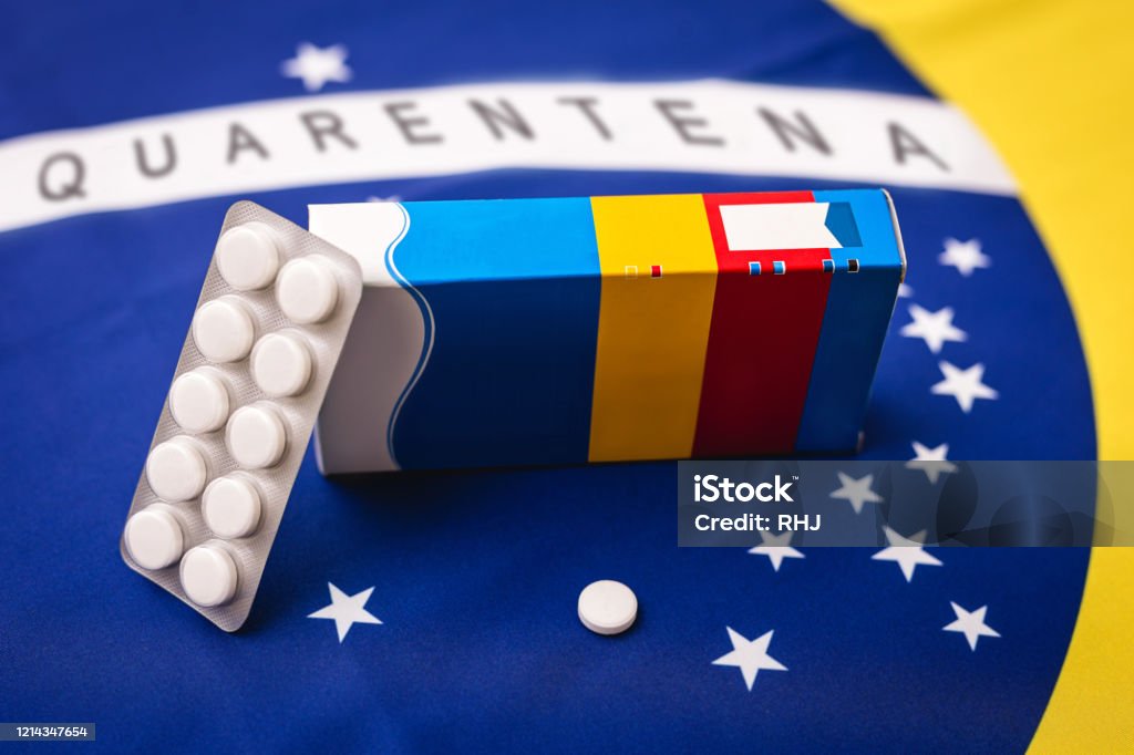 flag of brazil with pack of pills and medicine box. Concept of quarantine in Brazil due to Coronavirus. Research on covid-19 Bacterium Stock Photo