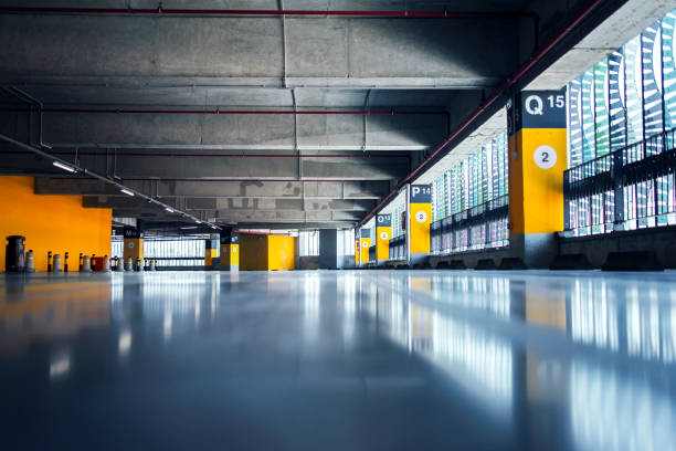 istock Interior of an empty parking garage in shopping mall. 1214347784