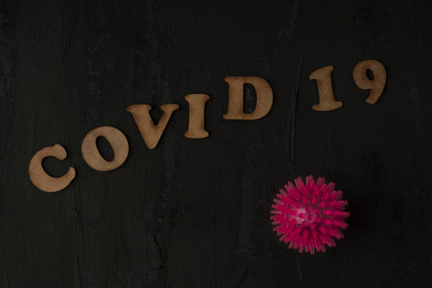 istock Covid 19 corona virus background on black 1214348048