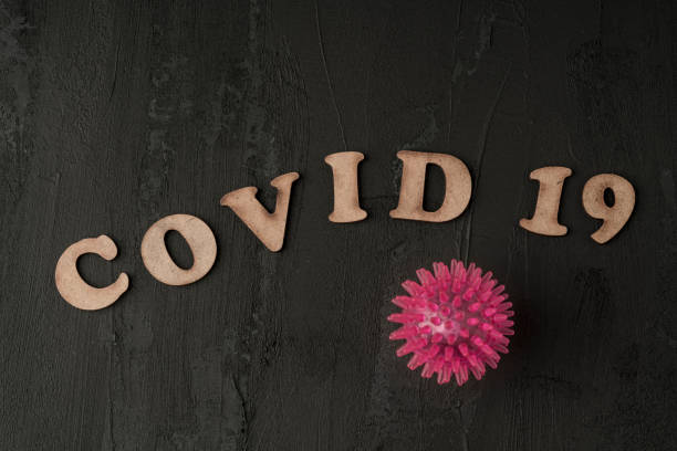 istock Covid 19 corona virus background on black 1214348053