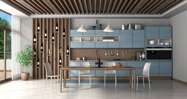 istock Blue and wooden kitchen with dining table 1214348399