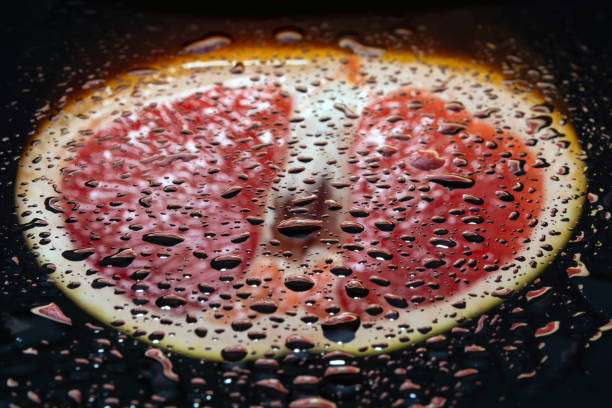 istock grapefruit pulp with drops of moisture on a black mirror 1214349509