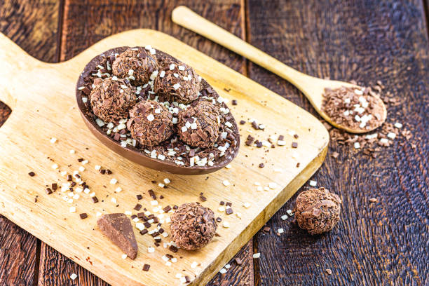 istock brazilian easter egg, chocolate egg with spoon for dessert. Easter tradition in Brazil, goumert egg chocolate. 1214350003