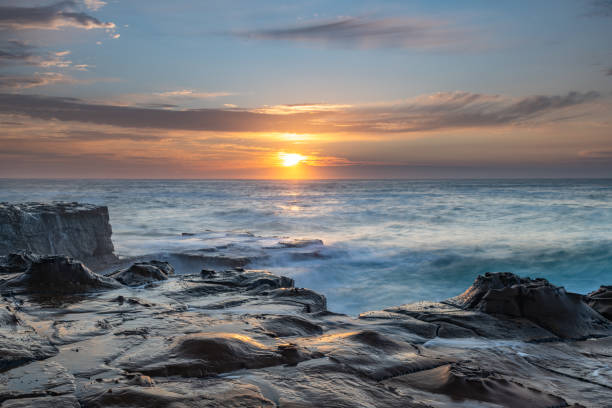 Coastal Sunrise Seascape from Rock Platform Sunrise Seascape from the North Avoca Beach rock platofrm on the Central Coast, NSW, Australia. avoca beach photos stock pictures, royalty-free photos & images