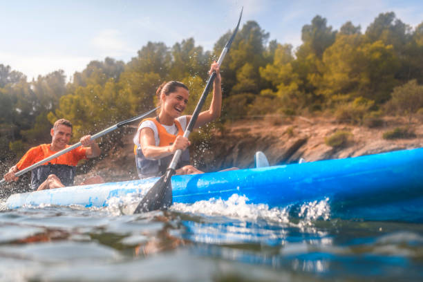 istock Energetic Spanish Kayakers Paddling Past Camera 1214353577