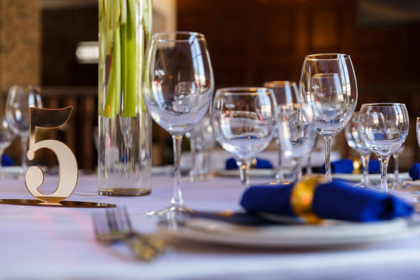istock Glasses for wine and champagne on a served table at a banquet 1214355691