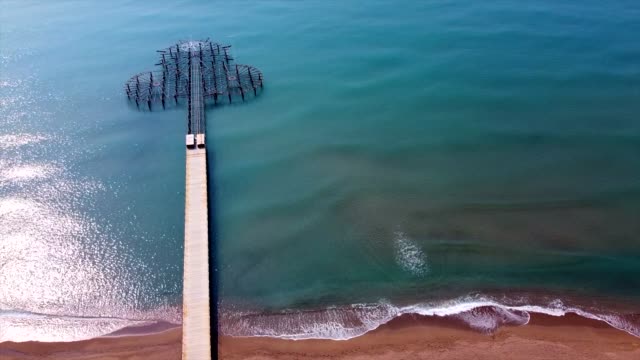 aerial shot coast and pier with drone