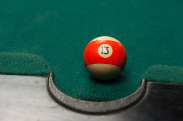 istock Billiards balls and cue on billiards table. Billiard sport concept. 1214357120