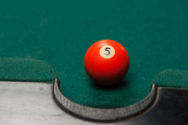 istock Billiards balls and cue on billiards table. Billiard sport concept. 1214357205