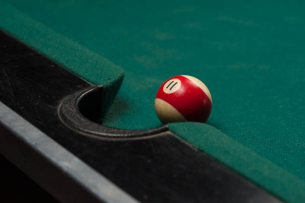 istock Billiards balls and cue on billiards table. Billiard sport concept. 1214357216