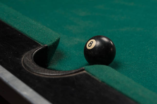 istock Billiards balls and cue on billiards table. Billiard sport concept. 1214357261