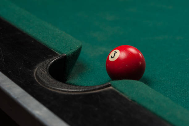 istock Billiards balls and cue on billiards table. Billiard sport concept. 1214357853
