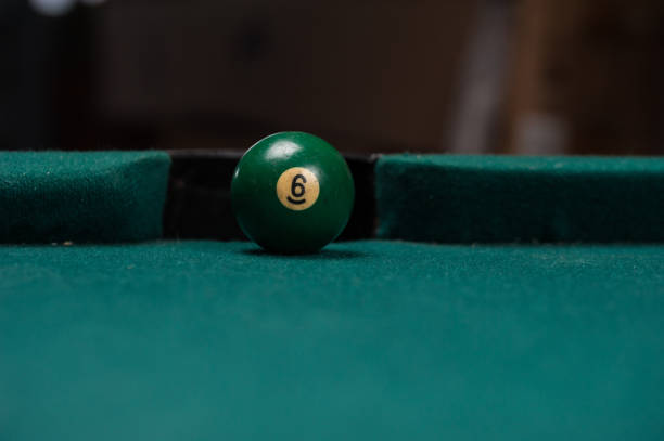 istock Billiards balls and cue on billiards table. Billiard sport concept. 1214357946