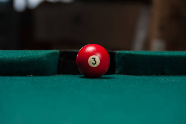 istock Billiards balls and cue on billiards table. Billiard sport concept. 1214357984