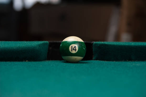 istock Billiards balls and cue on billiards table. Billiard sport concept. 1214357996