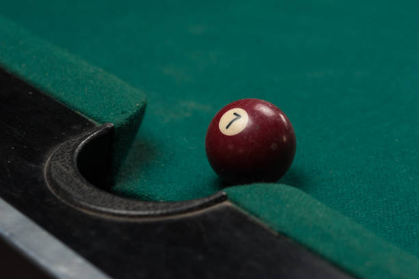istock Billiards balls and cue on billiards table. Billiard sport concept. 1214358020