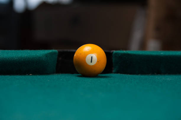 istock Billiards balls and cue on billiards table. Billiard sport concept. 1214358042