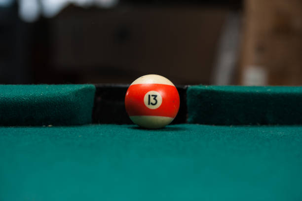 istock Billiards balls and cue on billiards table. Billiard sport concept. 1214358122