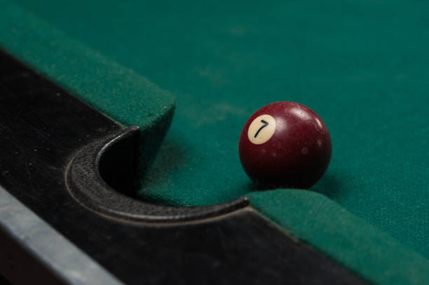 istock Billiards balls and cue on billiards table. Billiard sport concept. 1214358135