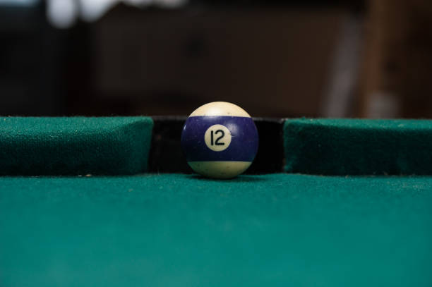 istock Billiards balls and cue on billiards table. Billiard sport concept. 1214358138