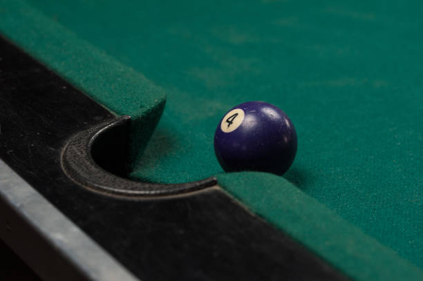 istock Billiards balls and cue on billiards table. Billiard sport concept. 1214358185